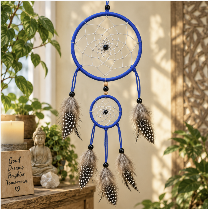 Calm Is Your Power Blue Double-Hoop Dreamcatcher blue dreamcatcher with spotted flowers hanging on a wall with plants, candle and buddha