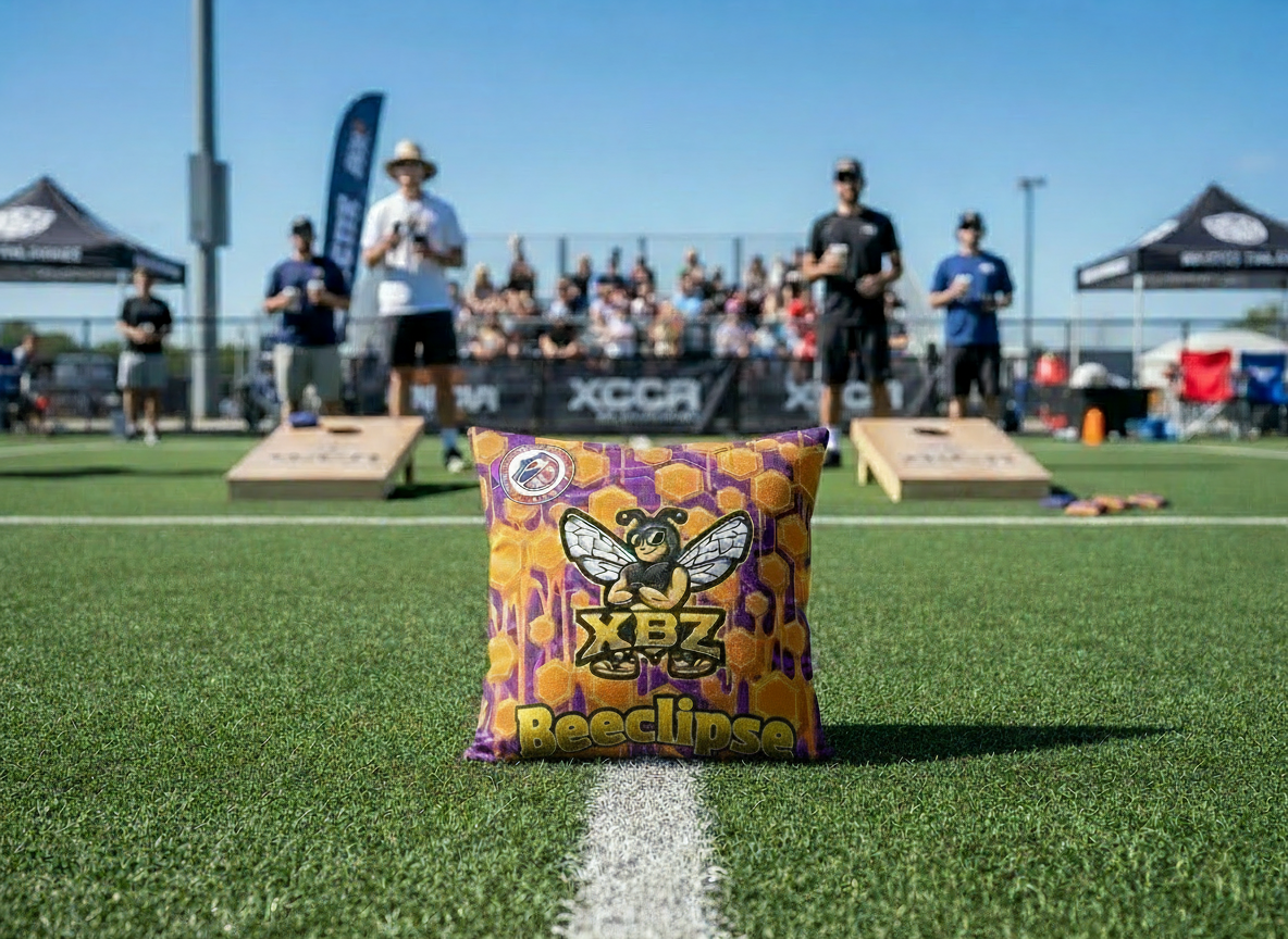 gold purple beeclipse cornhole bag
