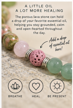 A close-up of a beaded essential oil dropper bracelet with pink, green, and porous lava stone beads, shown with promotional text and icons about breathing, healing, and being present.