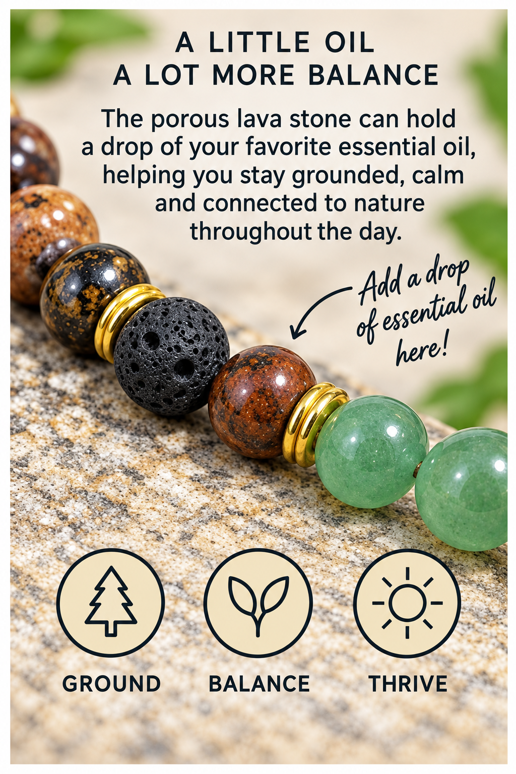 A close-up of a beaded stone tray or bowl with porous lava stones, green jade-like beads, and gold-toned spacers, placed on a stone surface with promotional text about essential oil and grounding benefits.
