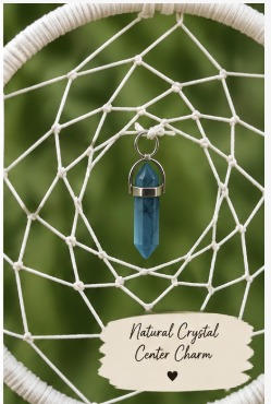 A natural blue crystal center charm hanging from a white dreamcatcher web against a blurred green background, with a cream-colored label at the bottom reading 'Natural Crystal Center Charm'.