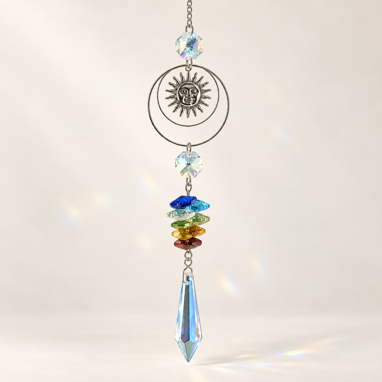 Turn Toward the Light Sun & Rainbow Suncatcher hanging in a while background