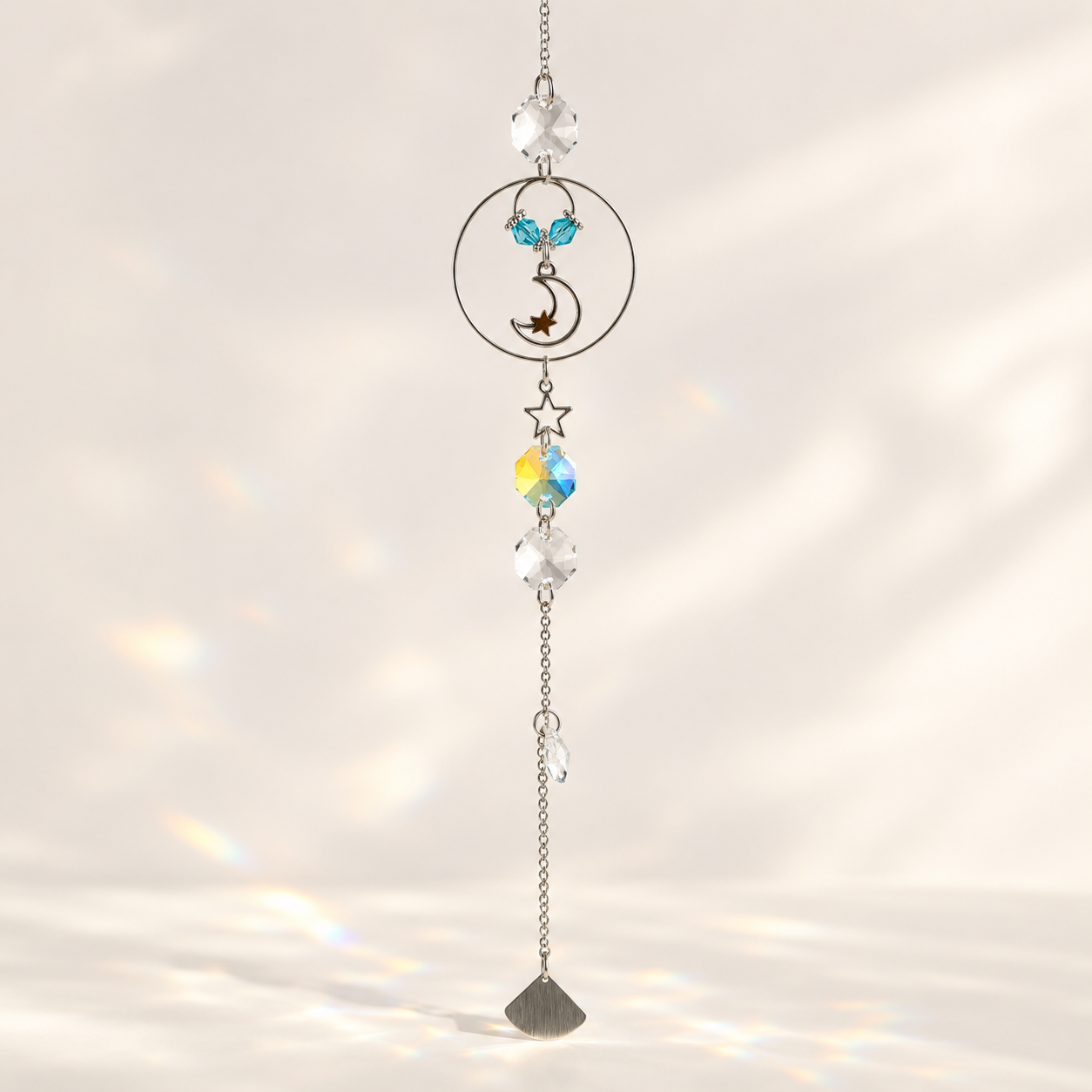 Dream, Believe & Shine Moon-and-Star Suncatcher hanging in white background