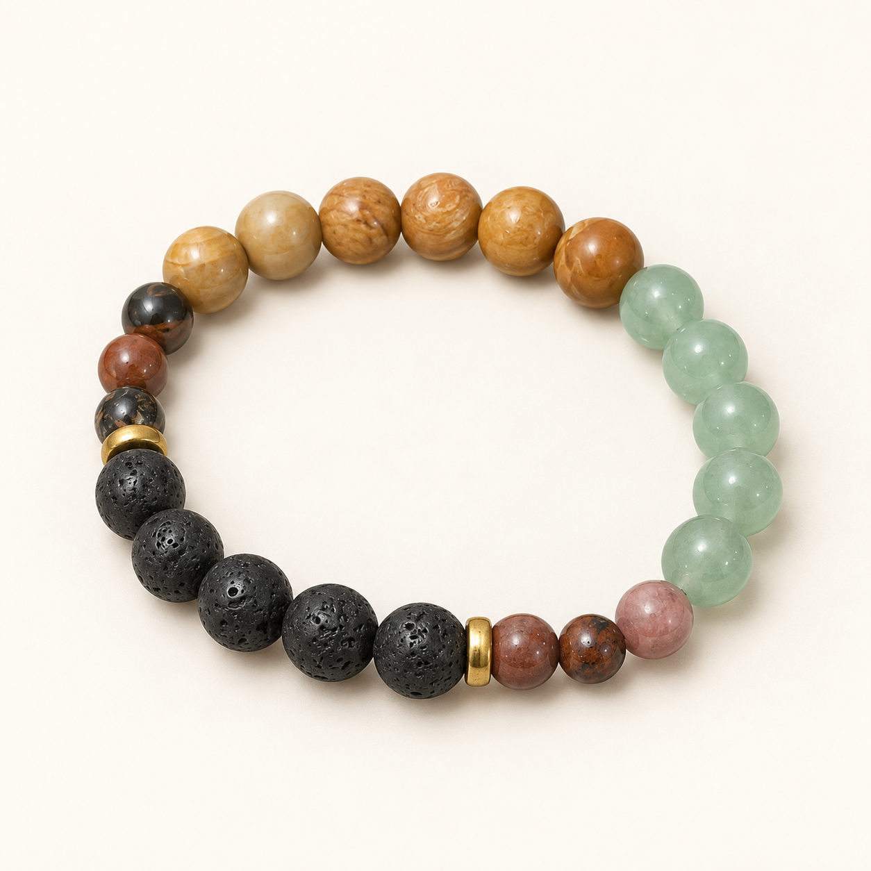 A beaded stretch bracelet arranged in a circle on a light cream background. The bracelet features a mix of natural stone beads in brown, beige, light green, black, pink, and reddish-brown, accented by two small gold spacer beads.