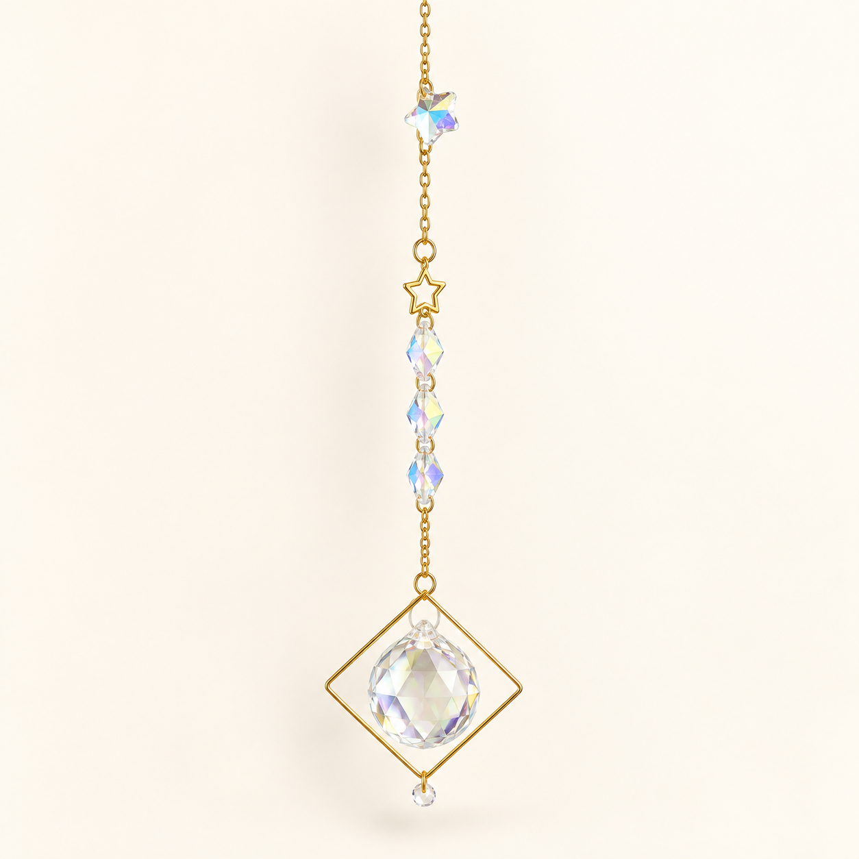 suncatcher with gold chain and accents, crystal ball and beads and gold star in white background