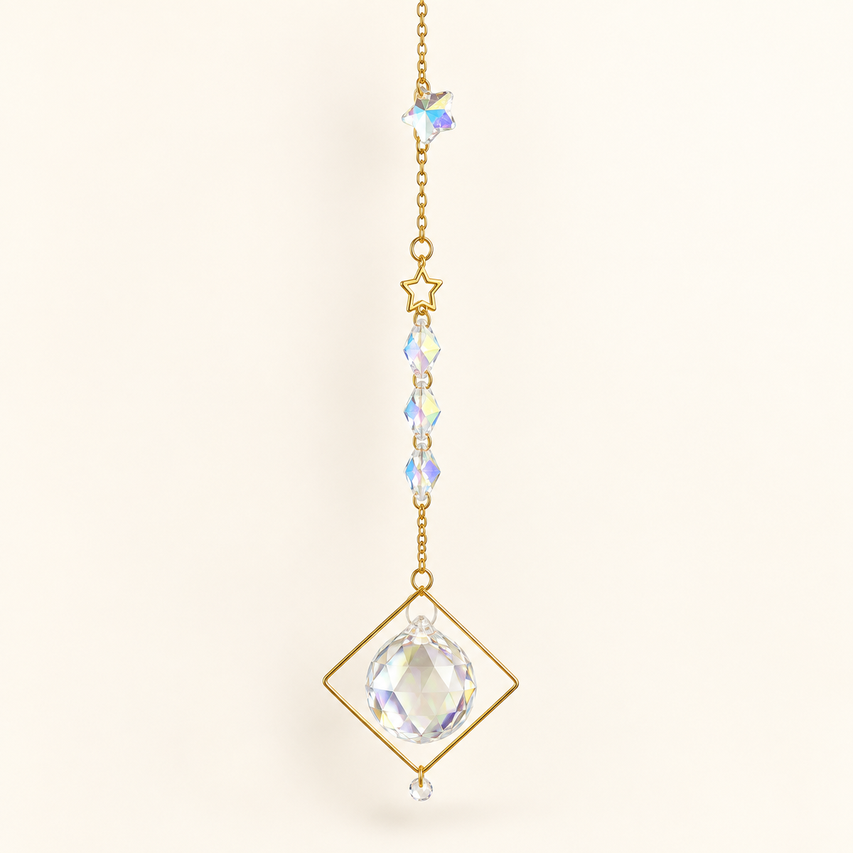 suncatcher with gold chain and accents, crystal ball and beads and gold star in white background
