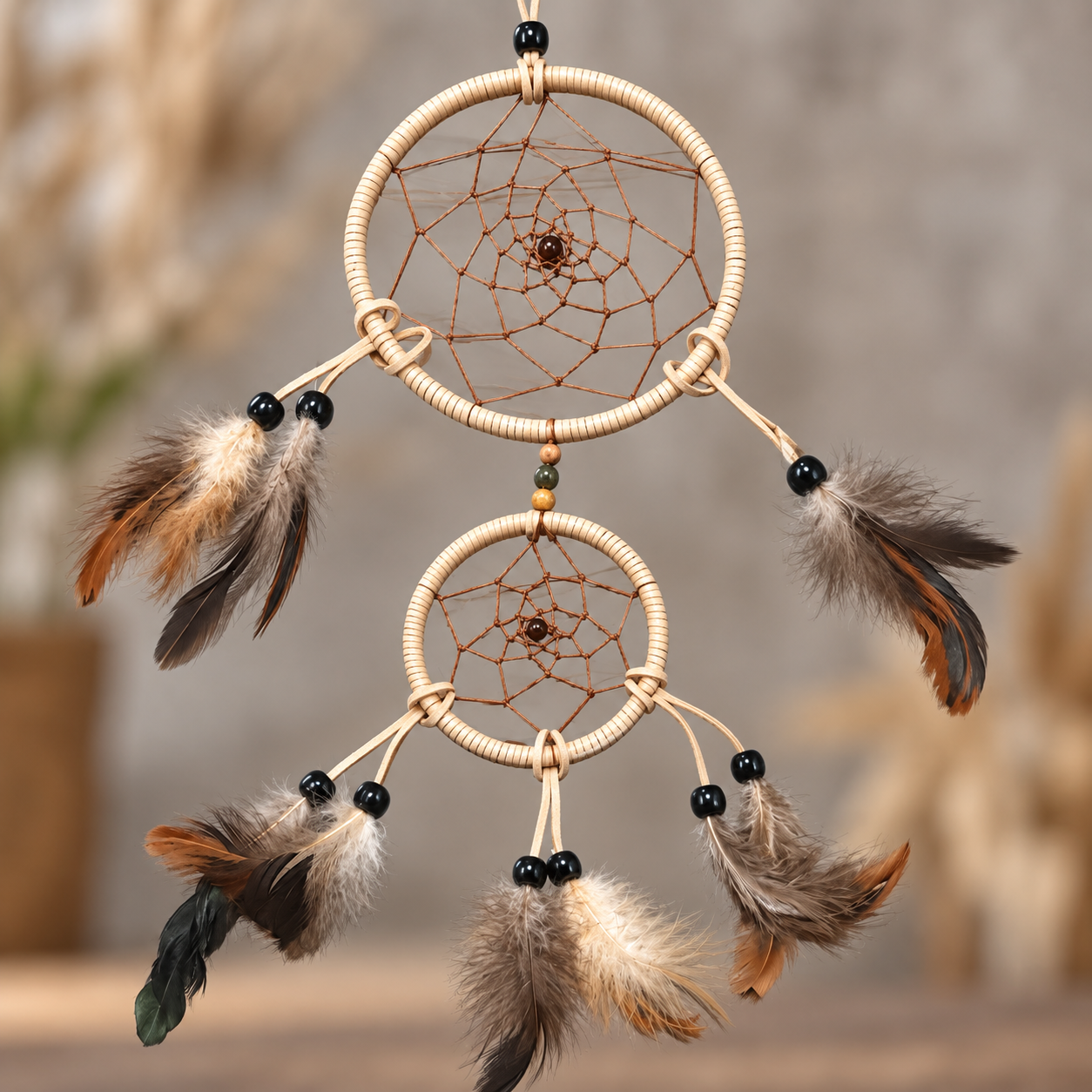 Wild Grace Tan Double-Hoop Dreamcatcher with blurry background